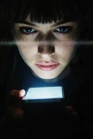 Signal Lost: a looping clip of a face lit by a single phone screen in darkness, a glitch line across the frame.